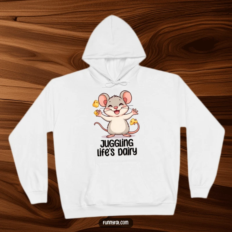 A warm, cozy hoodie showcasing a funny rat character enthusiastically juggling cheese cubes with a cheerful grin.